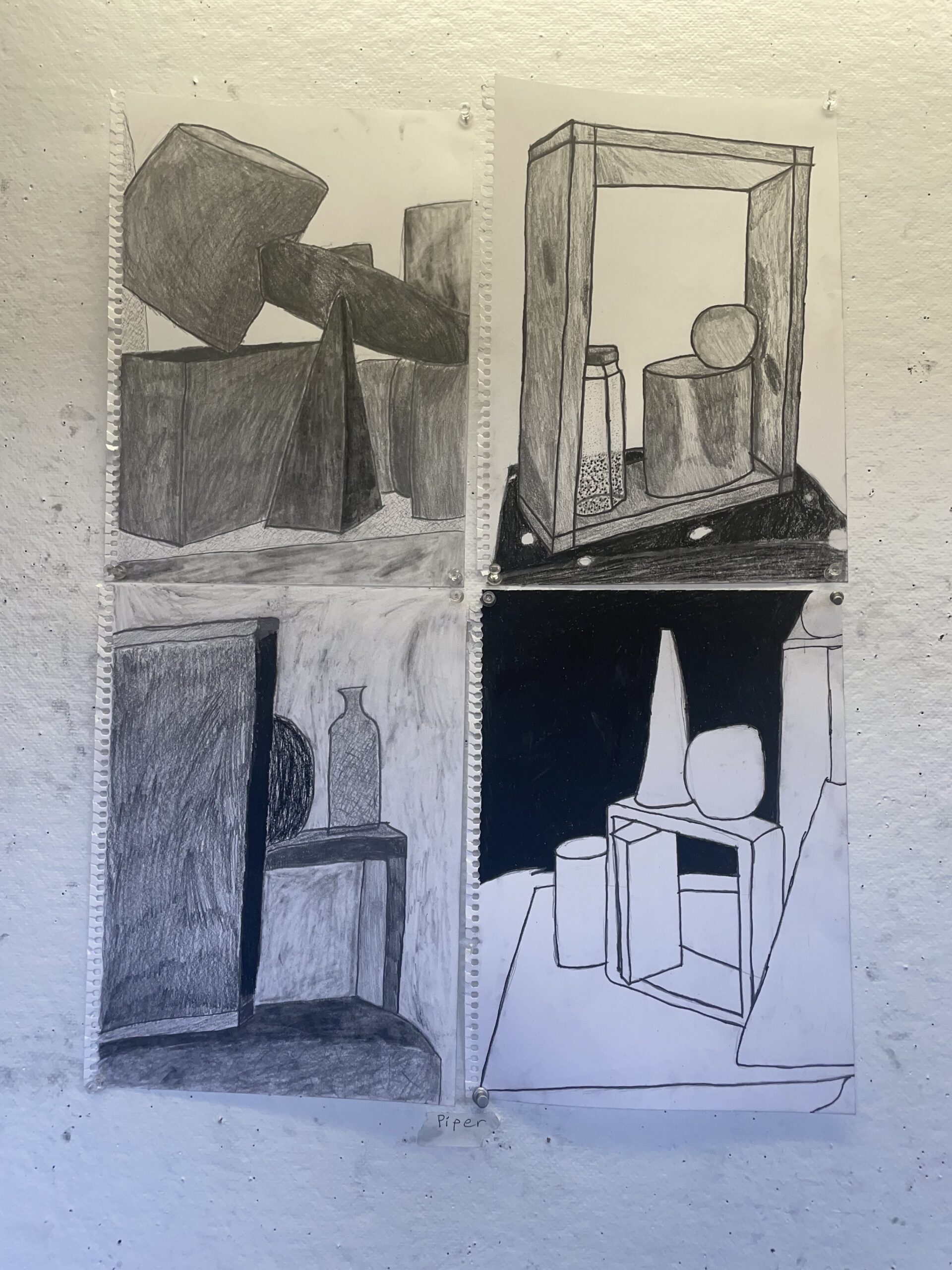 A view of four drawings lined up in a square. Each depicts a still-life and uses a variety of materials.